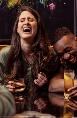 Friends celebrating at a bar